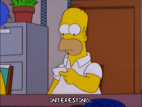 Homer Simpson puts on reading glasses and examines notes saying 'interesting'