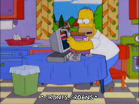 Homer Simpson throws computer into rubbish bin and grunts